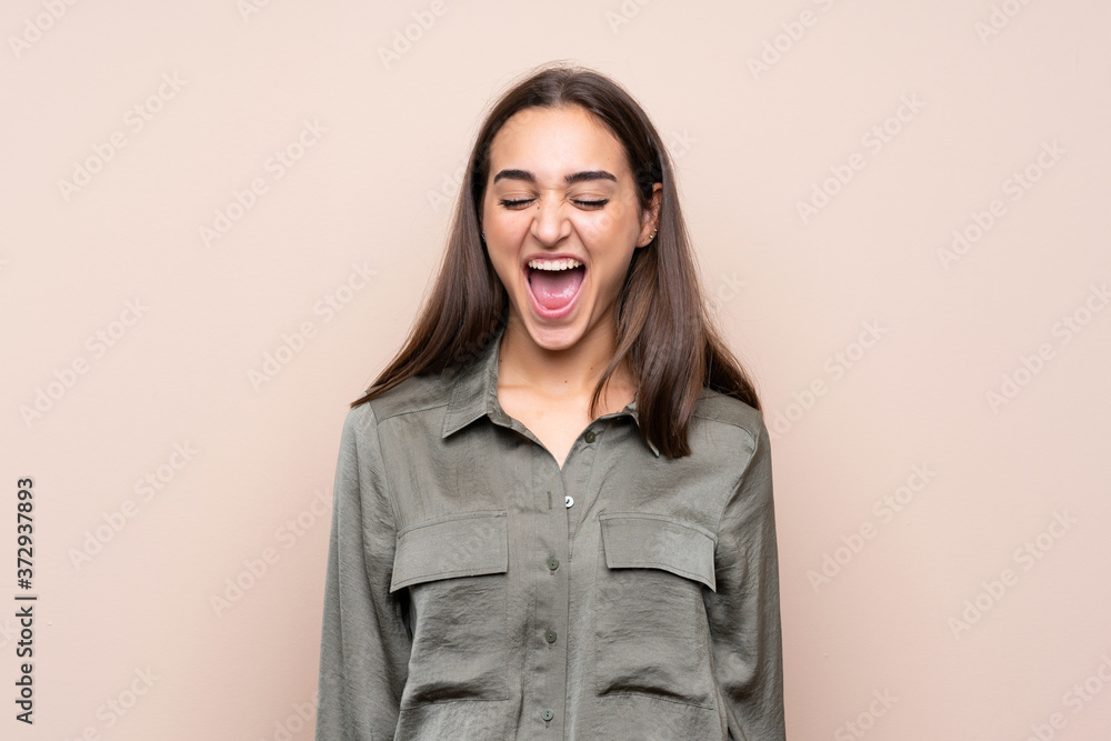 Young girl over isolated background shouting to the front with mouth wide open Young girl over isolated background shouting to the front with mouth wide open