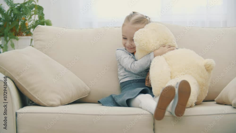 4k video of little girl hugging teddy bear toy. 4k video of little girl hugging teddy bear toy.