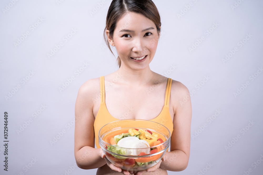Young Asian women eat healthy food, Isolated on white background. Young Asian women eat healthy food, Isolated on white background.