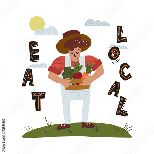 Eat local lettering, farmer holds wood crate with fresh vegetables like carrots, beet and lettuce.Healthy eating concept