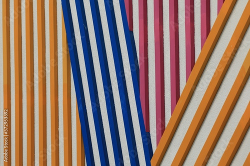 background of colored stripes on the wall of the building