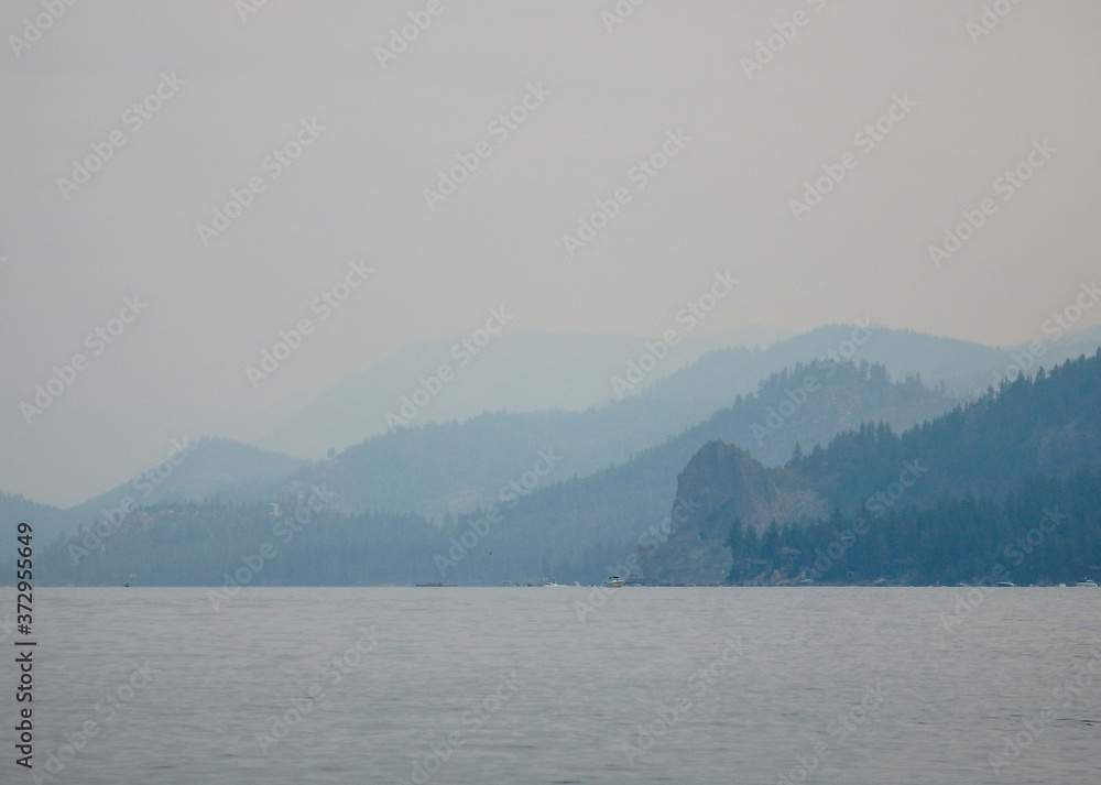 Smokey Skies Over Lake Tahoe and layers of Shrouded Ridgelines from Nevada Beach Nevada in from Wildfires of August 2020