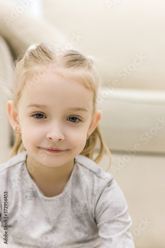 Happy little girl on close up portrait photo.