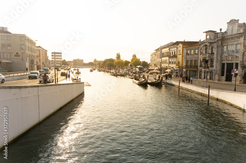 Urban water channel with gondolas in front of historical buildings