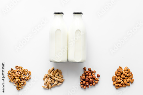 Bottles of non-dairy vegan milk - lactose free nuts and grain drink. Top view