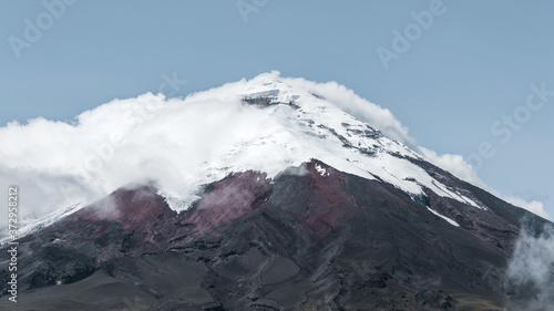 Beautiful shot of the Cotopaxi Volcano surrounded by clouds in Ecuador