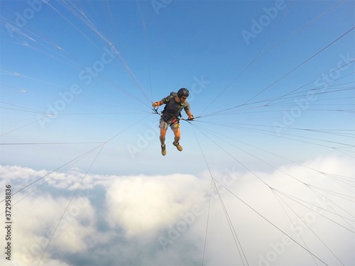 Paragliding point of view above the clouds