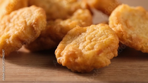 Close up of male hand take tasty chicken nugget