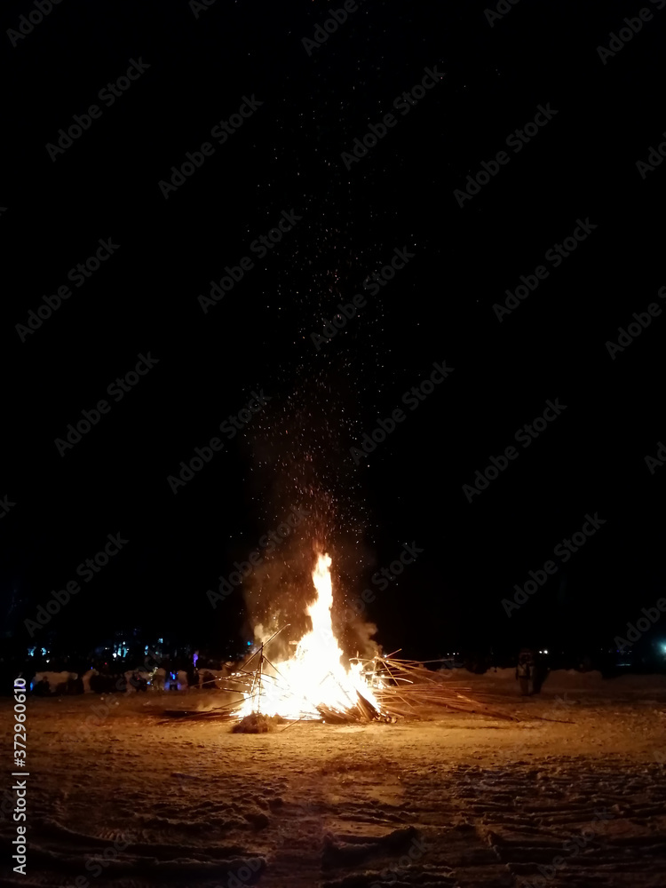 People Gathered around a Bonfire