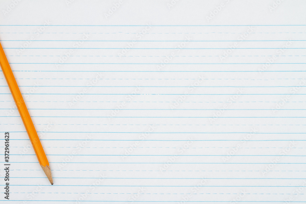 Retro lined school paper with a pencil background Retro lined school paper with a pencil background