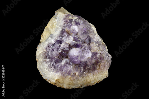 Amethyst gem stone. Amethyst specimen isolated on black background