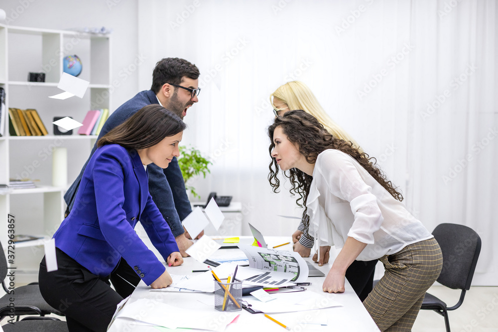 Obraz premium Crop of four businesspeople having lively discussion.