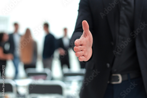 young man welcomes in office