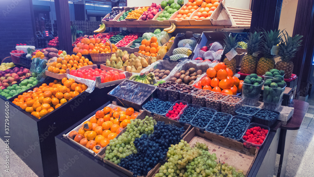 Food market showcase with fresh fruits and berries