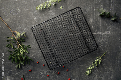 Decorated concrete background with grid cake tray photo