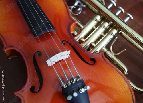 Stack of musical instruments - violin and trumpet