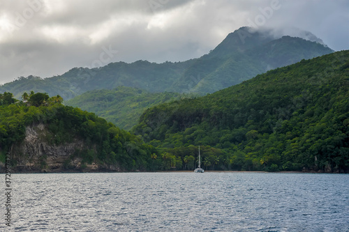 Fototapeta Naklejka Na Ścianę i Meble -  A view across a bay in St Lucia as a storm approaches