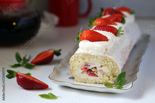 Biscuit roll with cream and strawberry