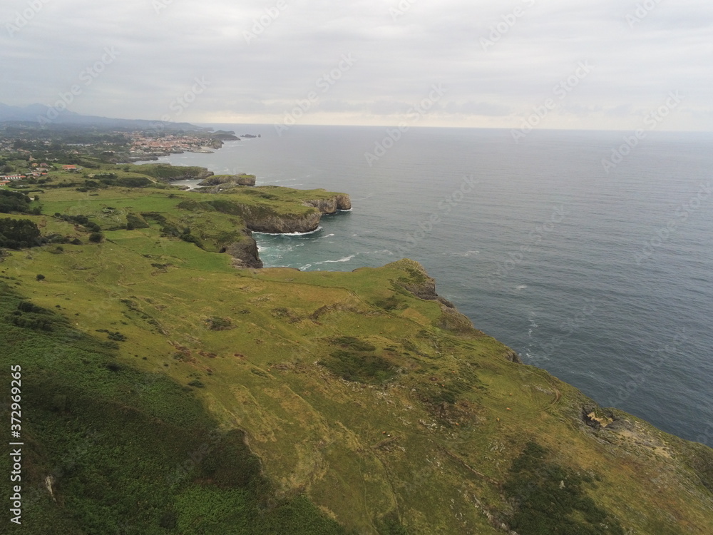 Asturias.  Coastal cliffs landscape in beach of Cue.Spain. Aerial Drone Photo