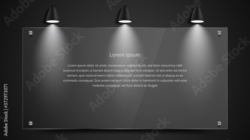 Blank movie posters illuminated by spotlights