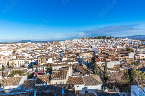 Panoramic view of the city of Antequera with its white houses and tile roofs, wonderful sunny day with a blue sky in the province of Malaga Spain