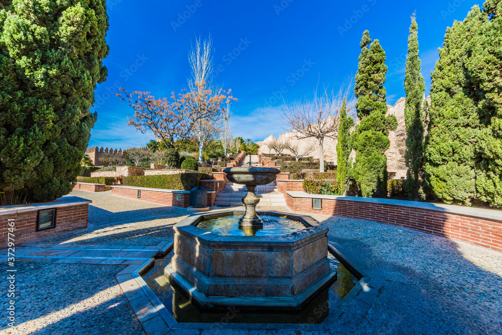 Fountain in the Alcazaba garden in Almeria Spain on a wonderful and sunny day with a blue sky