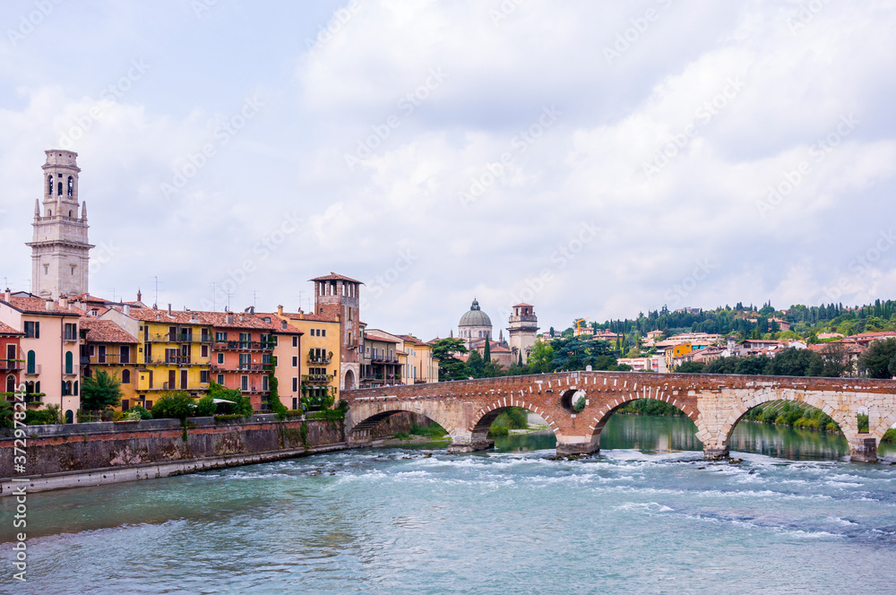 Verona Cathedral and Ancient Roman Bridge called Ponte di Pietra on Adige River in Verona, Northern Italy.