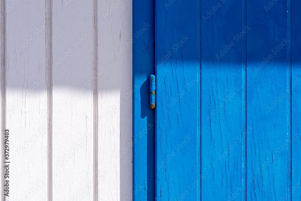 White and blue wooden background with a hinge in the middle White and blue wooden background with a hinge in the middle