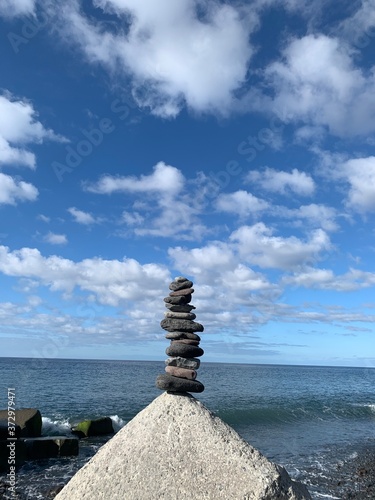 pyramid of stones on the beach, balanced rocks in sao vicente, madeira island