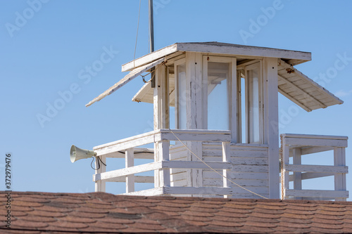 White wooden lifeguard tower on the beach