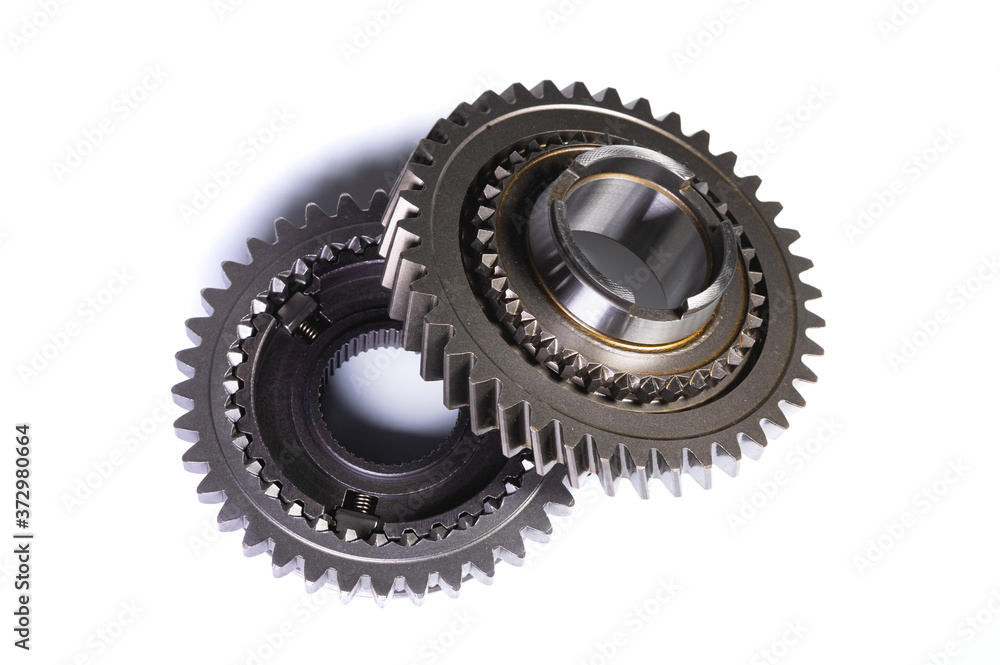 Two gears from car gearbox on white isolated background Two gears from car gearbox on white isolated background