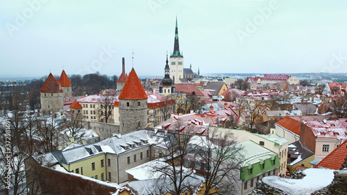 Winter view on roof tiles of Tallinn city buildings