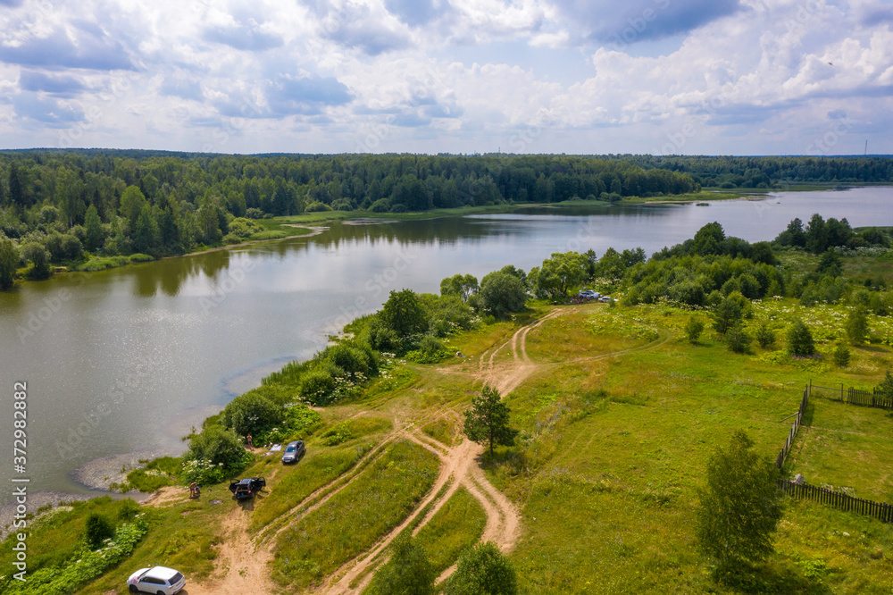 A large reservoir near the village of Ushakovka, Ivanovo region on a summer day. A large reservoir near the village of Ushakovka, Ivanovo region on a summer day.