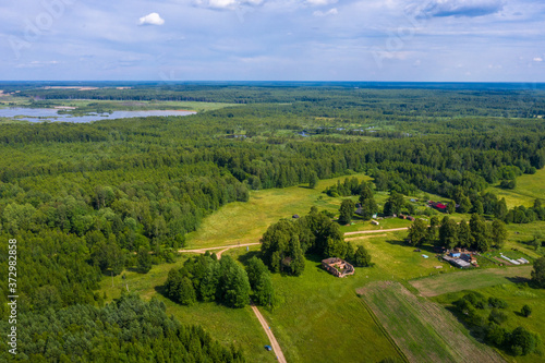 Maluevo village, Ivanovo region and Maluevskoe swamp surrounded by forest on a summer day. © Valery Smirnov