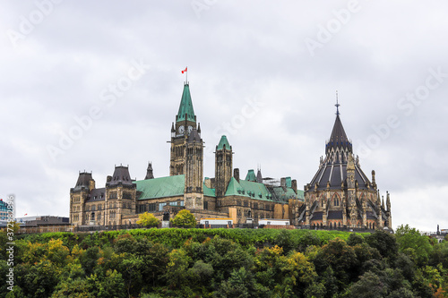 Parliament Hill, Ottawa, Rideau canal in Autumn. Cloudy sky