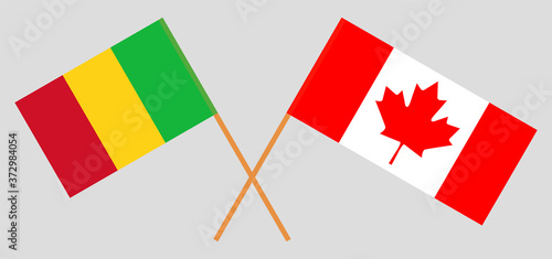 Crossed flags of Mali and Canada