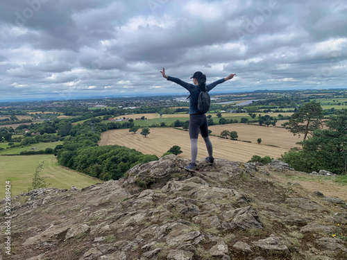 Hiking, walking, single female, with countryside view