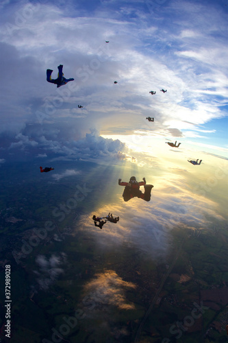 Canvas Print skydive big group in freefall at sunset