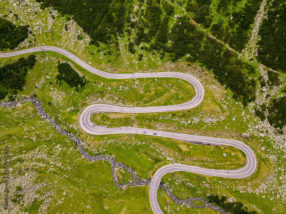 Aerial view of Transfagarasan pass in summer. Crossing Carpathian mountains in Romania, is a spectacular mountain road. Aerial view of Transfagarasan pass in summer. Crossing Carpathian mountains in Romania, is a spectacular mountain road.