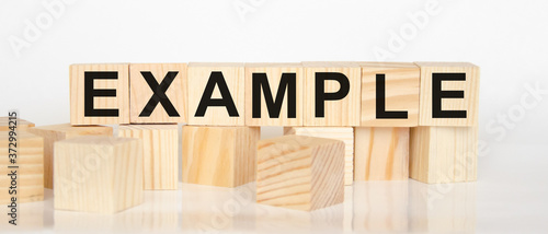 Cuadro en lienzo word example written on wooden cubes and white background