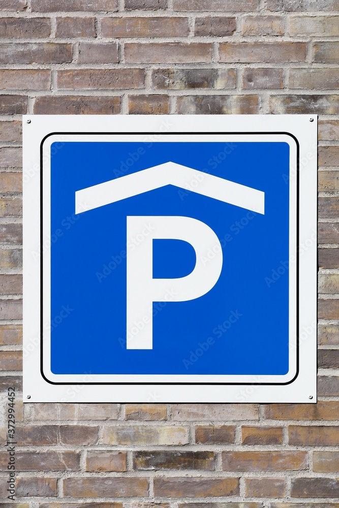 Indoor parking area sign on a wall Indoor parking area sign on a wall