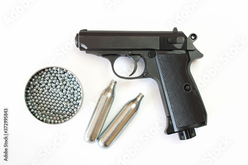 Air gun with cartridges and steel balls (pellets) photo