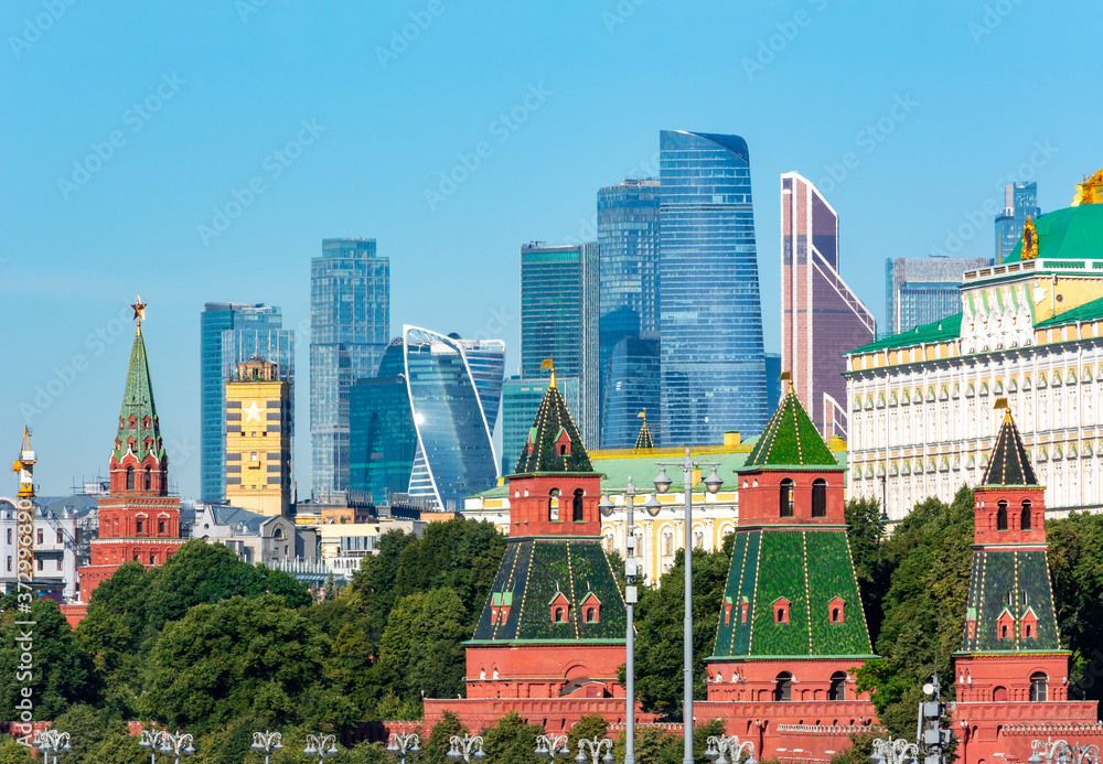 Towers of Moscow Kremlin with International Business Center (Moscow City) at background, Russia