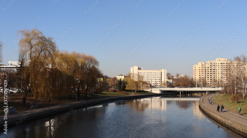 autumn MInsk central street with buildings and quayside