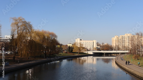 autumn MInsk central street with buildings and quayside