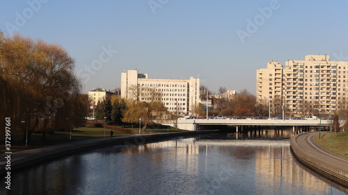 autumn MInsk central street with buildings and quayside © Mikalai Drazdou