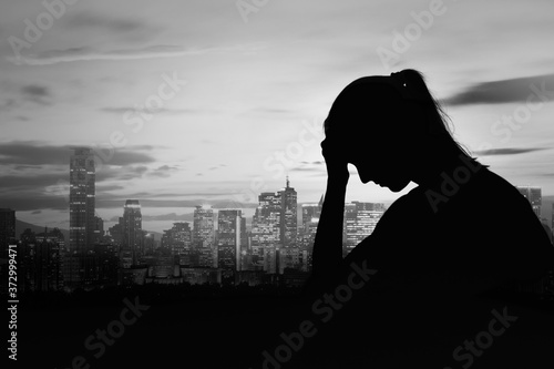 Принти на полотні Sad, depressed woman  silhouette in the city