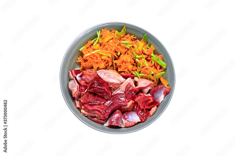Natural raw dog food in bowl isolated on white background Meat and vegetables BARF diet Natural raw dog food in bowl isolated on white background Meat and vegetables BARF diet