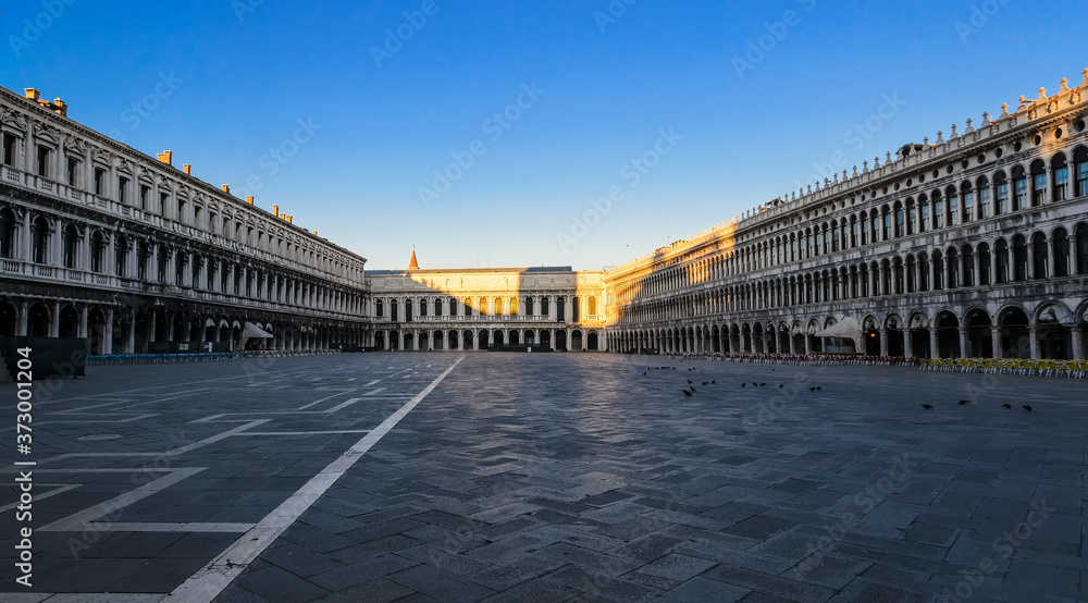 Wide panorama of St. Mark's Square at sunrise (Piazza San Marco). Venice