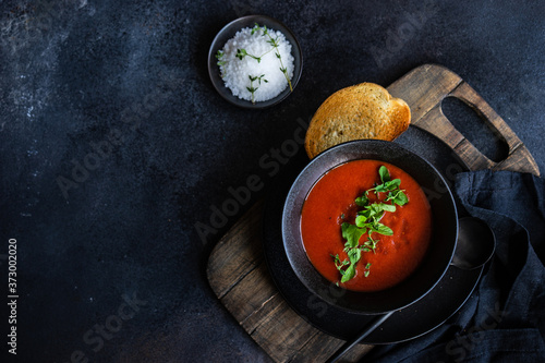 Gazpacho soup served in black bowl